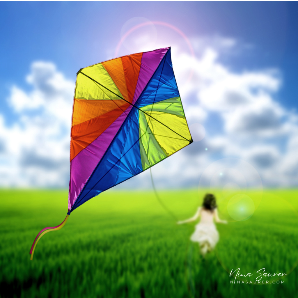 A colorful kite gracefully soars high in the blue sky, symbolizing the potential for personal success when coupled with aligned action and persistence.